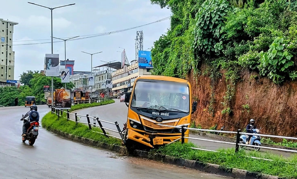 Manipal school bus climbs divider near Syndicate Circle after losing control